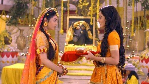 Radha guides Rukmini Radha guides Rukmini