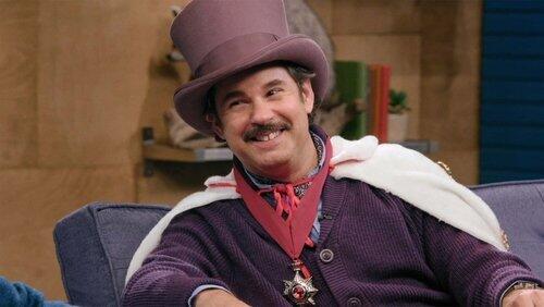 Lord Andrew Lloyd Webber Wears A Purple Top Hat & Fabrice Fabrice Wears One Pink Fur Leg Warmer Lord Andrew Lloyd Webber Wears A Purple Top Hat & Fabrice Fabrice Wears One Pink Fur Leg Warmer