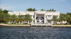 A Woman Bargains for Luxury with a Waterfront View A Woman Bargains for Luxury with a Waterfront View