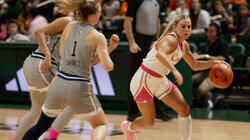 Cashing In: The Debate Over Paying College Athletes Cashing In: The Debate Over Paying College Athletes