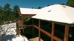 A Log Cabin Lookout with a Wrap-Around Porch A Log Cabin Lookout with a Wrap-Around Porch